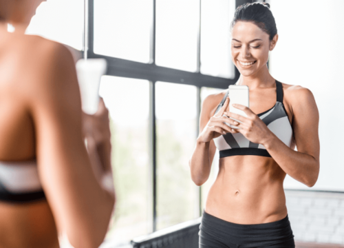 Photo of a woman taking a selfie at the gym