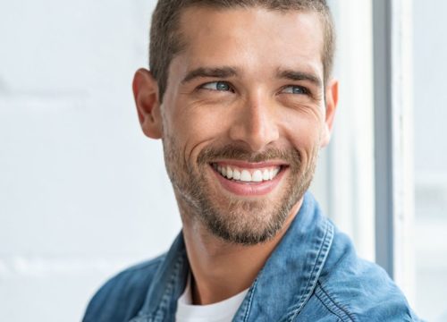 Smiling, happy man wearing a denim shirt