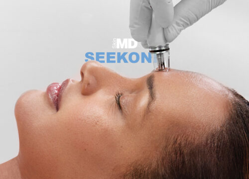 Photo of a woman getting a DiamondGlow treatment with Seekonk text in the background